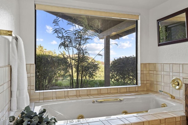 bathroom with tiled tub