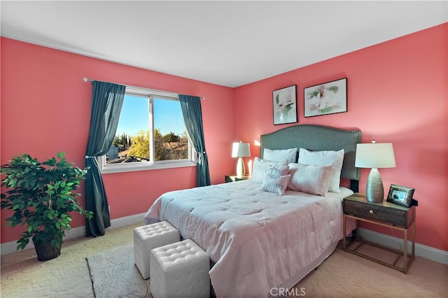 carpeted bedroom featuring baseboards