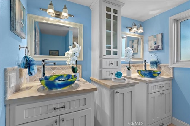 bathroom with vanity and backsplash