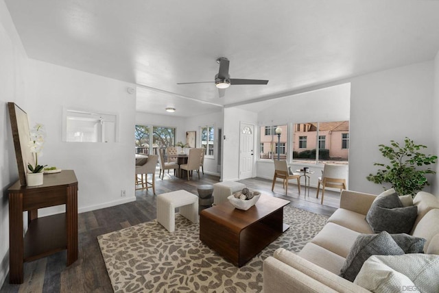 living room with lofted ceiling, dark hardwood / wood-style floors, and ceiling fan