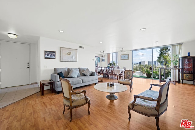 living room featuring light hardwood / wood-style floors and expansive windows