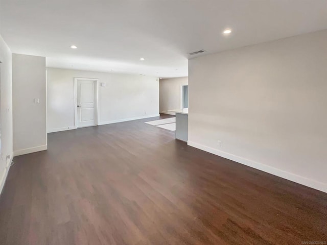 empty room featuring dark hardwood / wood-style flooring