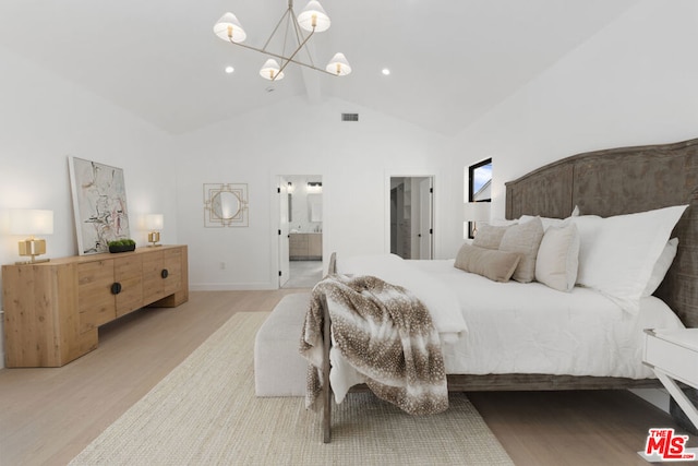 bedroom featuring light hardwood / wood-style flooring, an inviting chandelier, beam ceiling, high vaulted ceiling, and connected bathroom