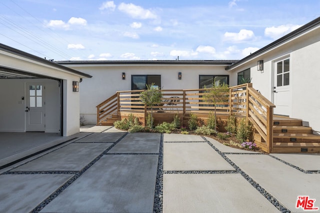 rear view of house featuring a patio