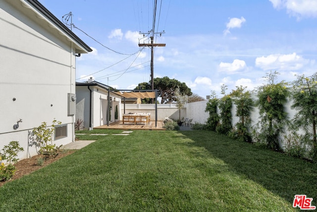 view of yard featuring a wooden deck