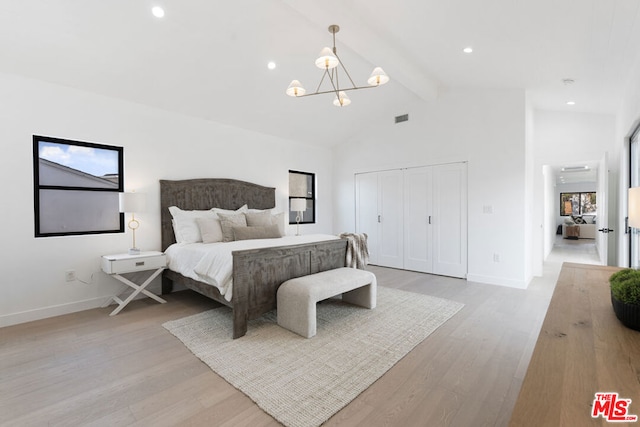 bedroom featuring high vaulted ceiling, a notable chandelier, light hardwood / wood-style floors, a closet, and beamed ceiling