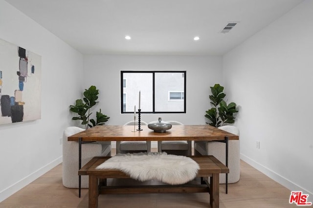 dining area featuring light wood-type flooring