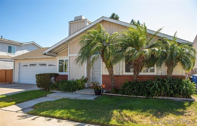 view of front of property featuring a garage and a front yard