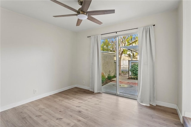 spare room featuring ceiling fan and light wood-type flooring