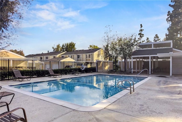 view of pool with a pergola and a patio area