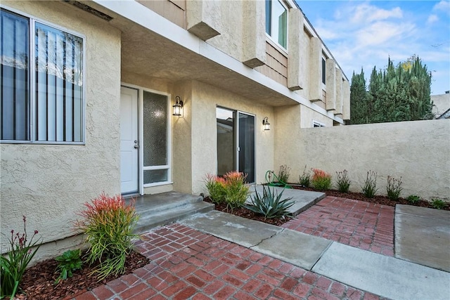 doorway to property with a patio area