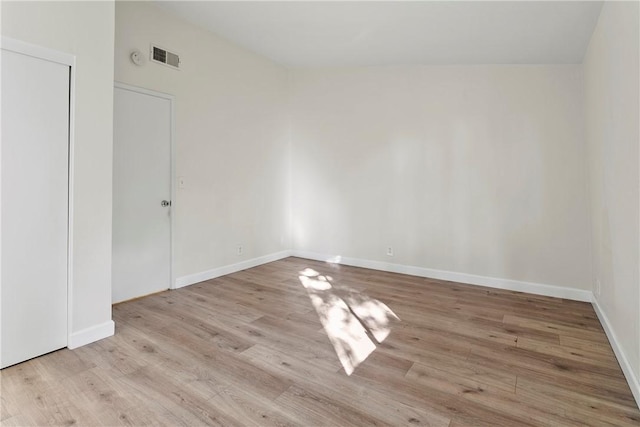 spare room with light wood-type flooring