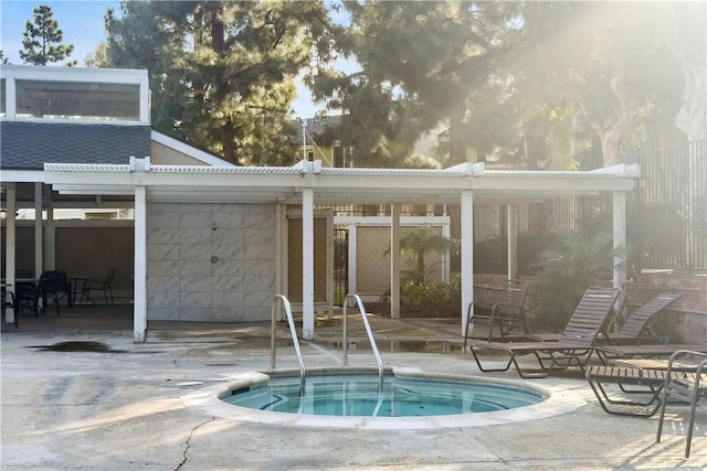 view of swimming pool with a community hot tub