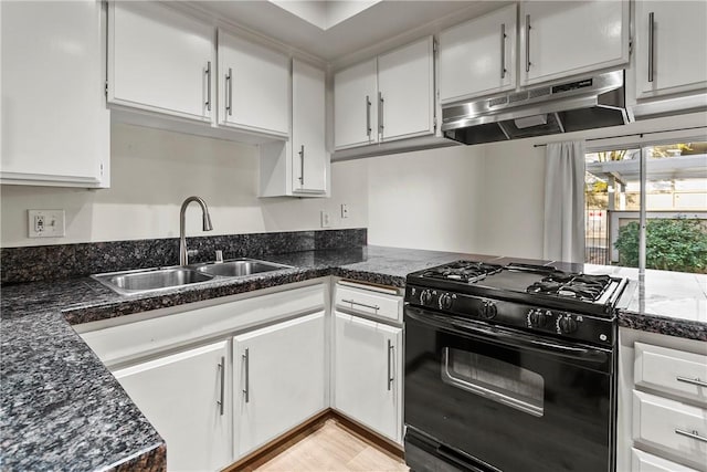 kitchen featuring white cabinetry, sink, light hardwood / wood-style flooring, and black gas stove