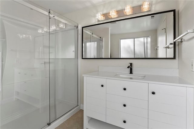 bathroom with vanity and walk in shower