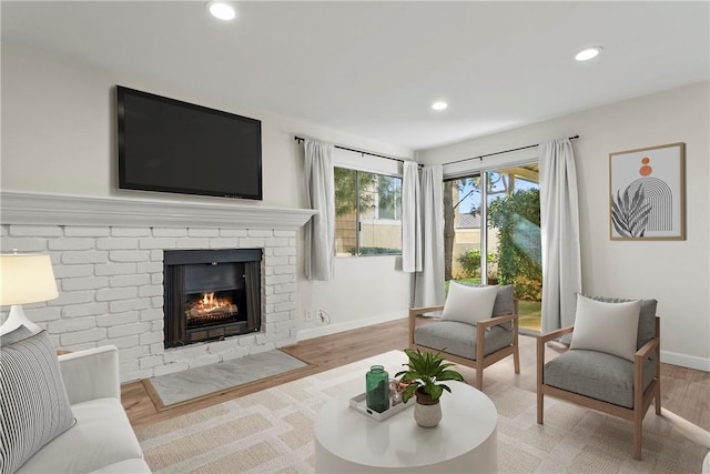 living room featuring hardwood / wood-style floors and a fireplace