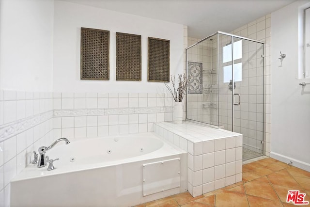 bathroom with tile patterned floors and plus walk in shower