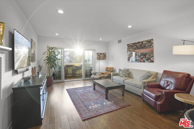 living room with dark wood-type flooring