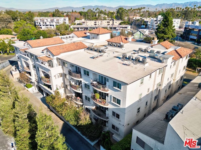 birds eye view of property with a mountain view