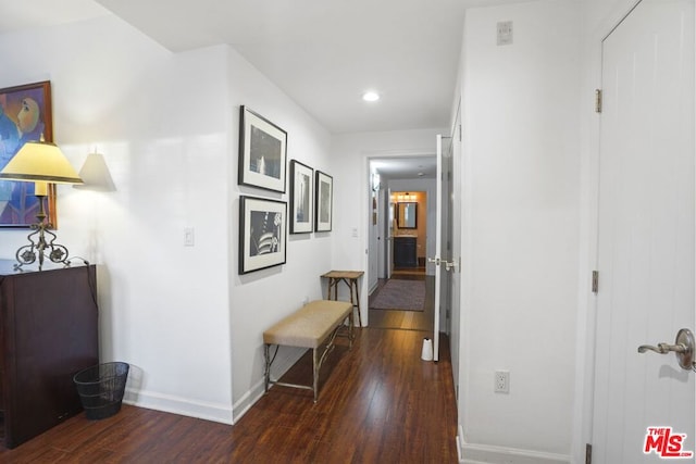 hallway featuring dark hardwood / wood-style flooring