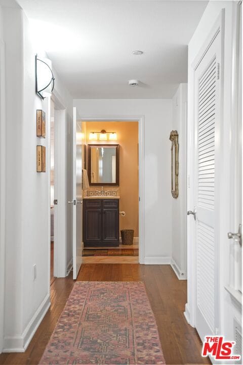 hall featuring dark wood-type flooring