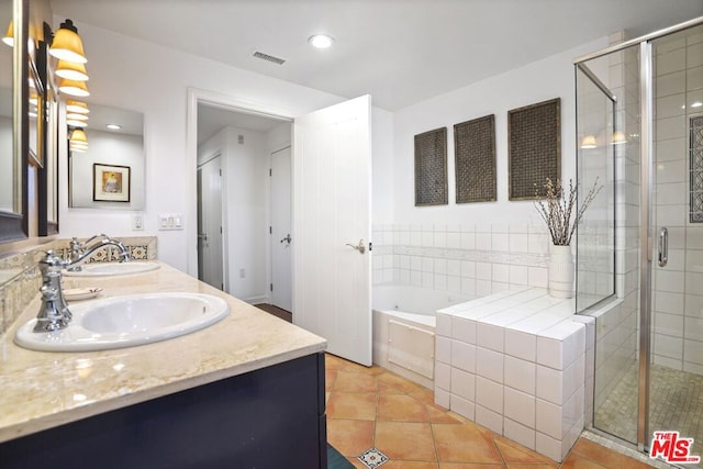 bathroom with vanity, tile patterned flooring, and separate shower and tub