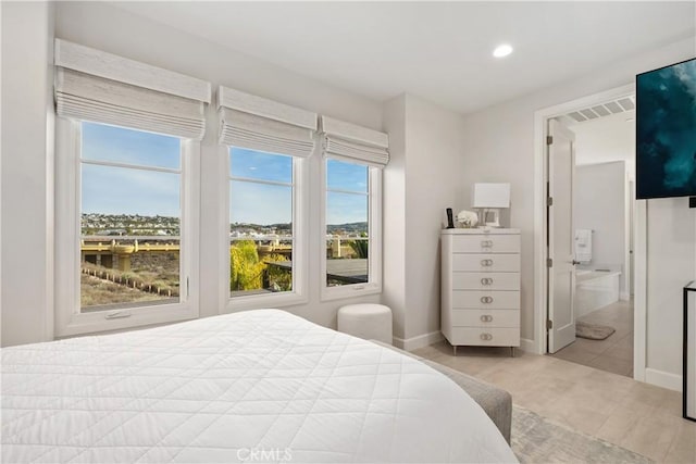 bedroom featuring ensuite bathroom