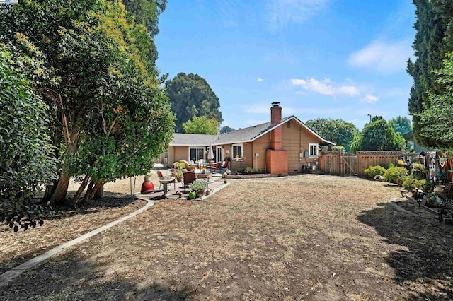 rear view of house with a patio