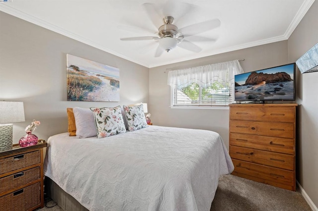 carpeted bedroom featuring ceiling fan and ornamental molding