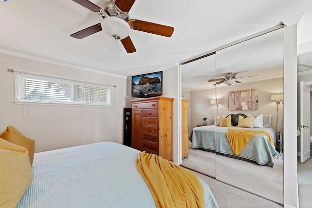 bedroom featuring crown molding, carpet, and ceiling fan