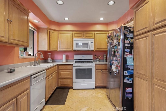 kitchen featuring light tile patterned flooring, sink, and white appliances