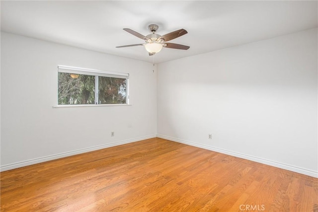 unfurnished room featuring ceiling fan and light wood-type flooring