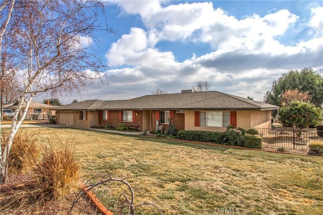 single story home featuring a garage and a front yard