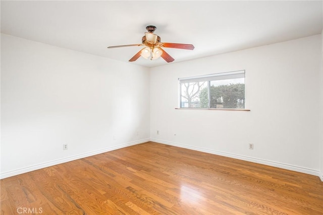 empty room with light hardwood / wood-style floors and ceiling fan