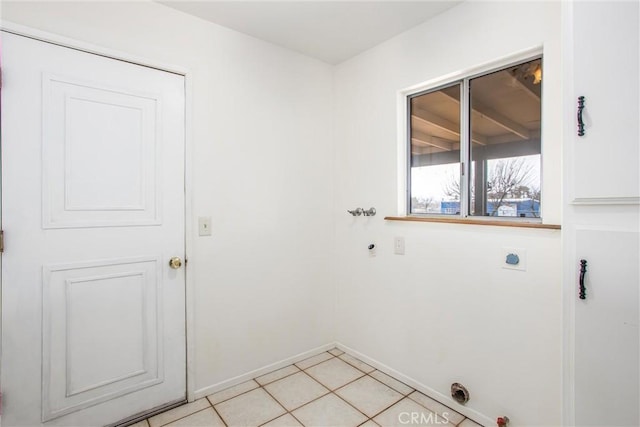 clothes washing area featuring light tile patterned floors and electric dryer hookup