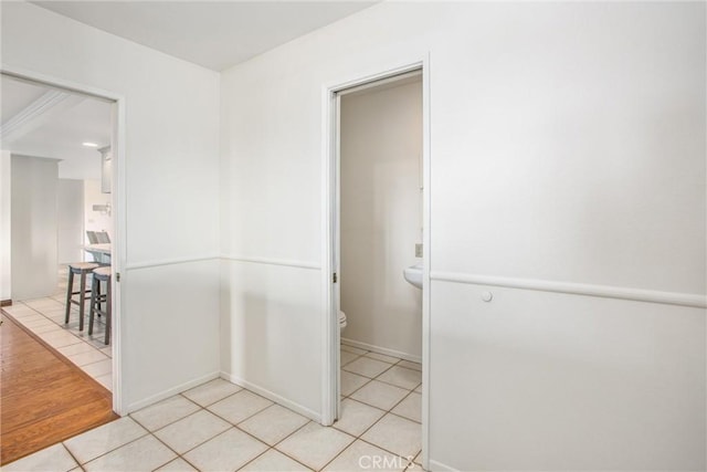 corridor featuring light tile patterned floors