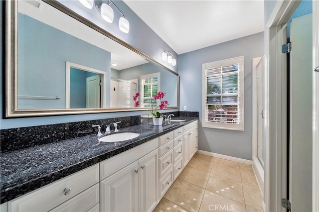 60 Peony, Irvine, CA 92618 - full bathroom featuring a shower stall, double vanity, tile patterned floors, and baseboards