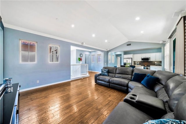 living room featuring visible vents, baseboards, vaulted ceiling, hardwood / wood-style floors, and recessed lighting