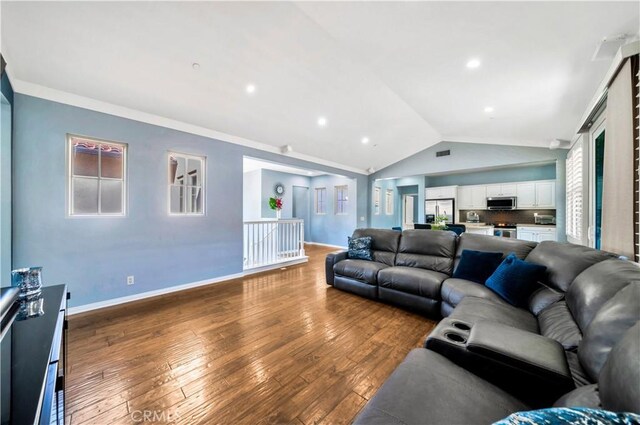 60 Peony, Irvine, CA 92618 - living room featuring vaulted ceiling, wood-type flooring, baseboards, and recessed lighting
