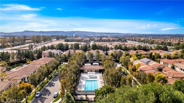 60 Peony, Irvine, CA 92618 - aerial perspective of suburban area featuring a pool area and a mountain backdrop