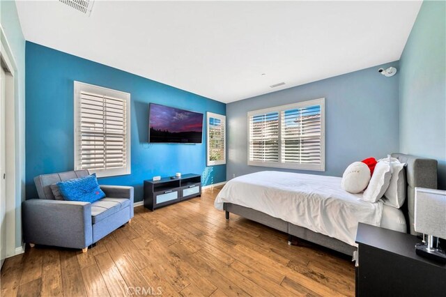 60 Peony, Irvine, CA 92618 - bedroom featuring hardwood / wood-style flooring and baseboards