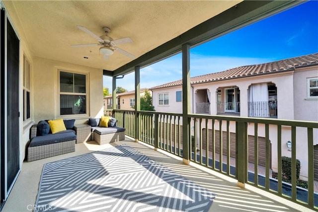 balcony featuring an outdoor living space and a ceiling fan