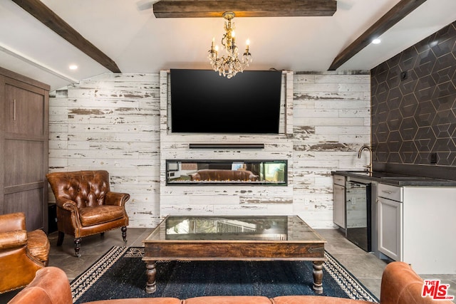 living room with wooden walls, vaulted ceiling with beams, beverage cooler, tile patterned floors, and an inviting chandelier