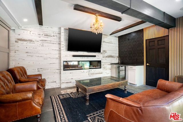 living room with an inviting chandelier, wine cooler, wet bar, beamed ceiling, and wood walls