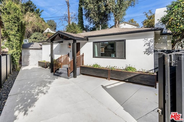 view of front of house with a patio area