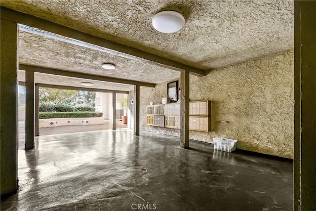 miscellaneous room featuring beam ceiling