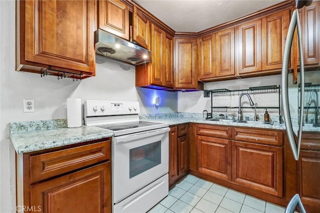 kitchen with sink, white range with electric cooktop, light stone countertops, a textured ceiling, and light tile patterned flooring