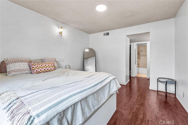 bedroom with dark hardwood / wood-style flooring