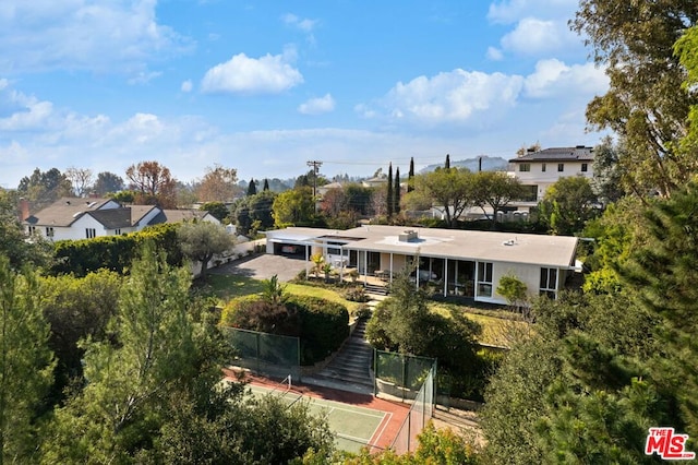 exterior space featuring tennis court