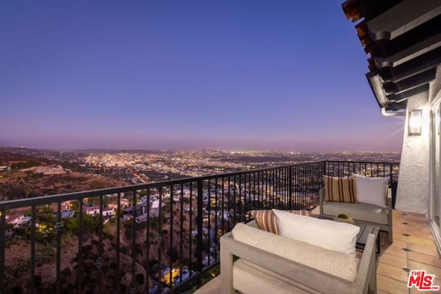 view of balcony at dusk